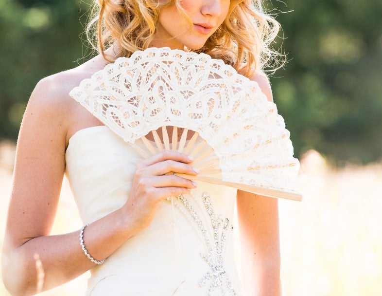 Provided wedding fans for guests to stay cool during the ceremony